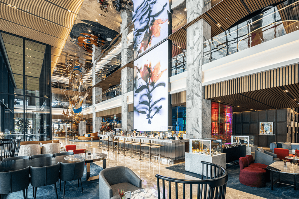 Mondrian hotel bar and lobby area in  Seoul with beautiful innovative interior design and a large custom led screen with the digital artwork: Flower by Guilhem Moreau, Powered by Niio