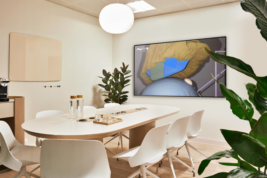 Conference room with modern and minimalist interior design and a large framed digital art work called Void Season by Zeitguised, Powered by Niio, as seen in Meet In Place, UK